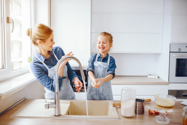 beautiful mother blue shirt apron is preparing dinner home kitchen